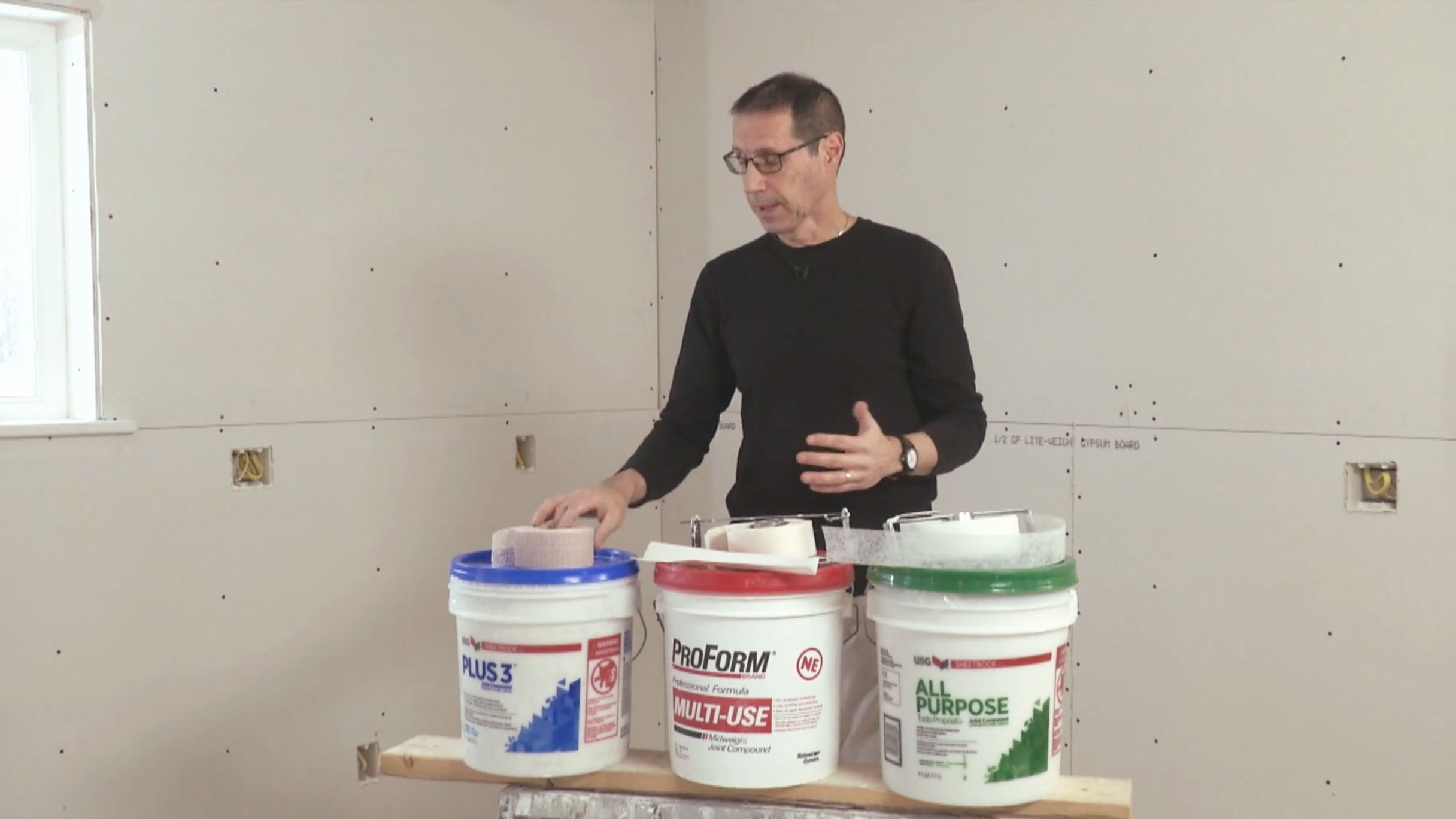 Myron with a display of different drywall tape