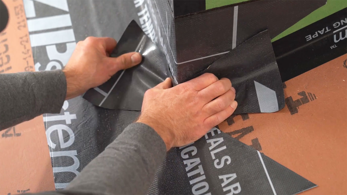 Installing peel-and-stick underlayment at a corner